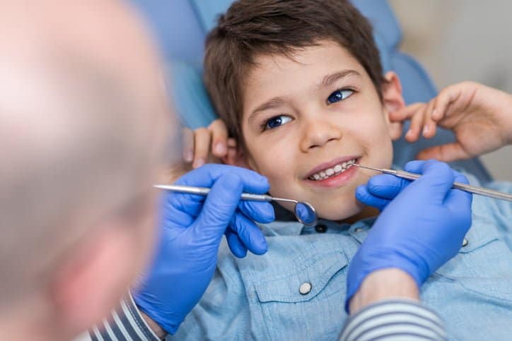 Dentist doing regular dental checkup