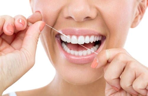 Flossing oral hygiene