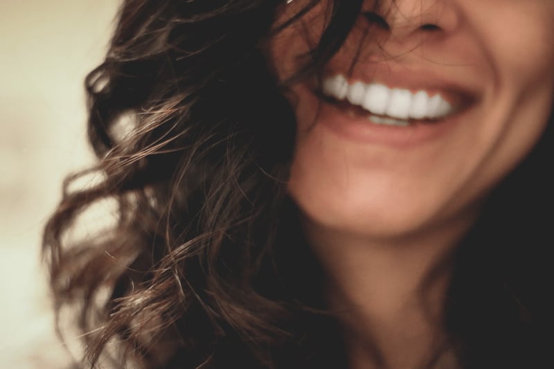 a woman smiling|Tips and Remedies from Your Dentist