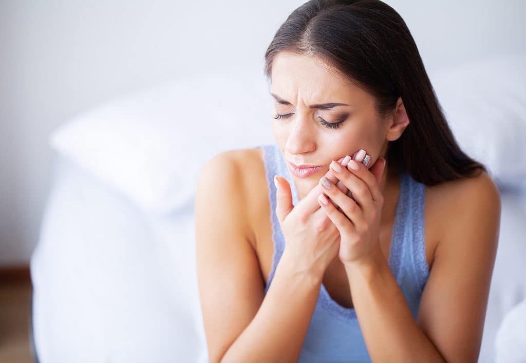 Closeup Of Beautiful Sad Girl Suffering From Strong Tooth Pain|Closeup Of Beautiful Sad Girl Suffering From Strong Tooth Pain